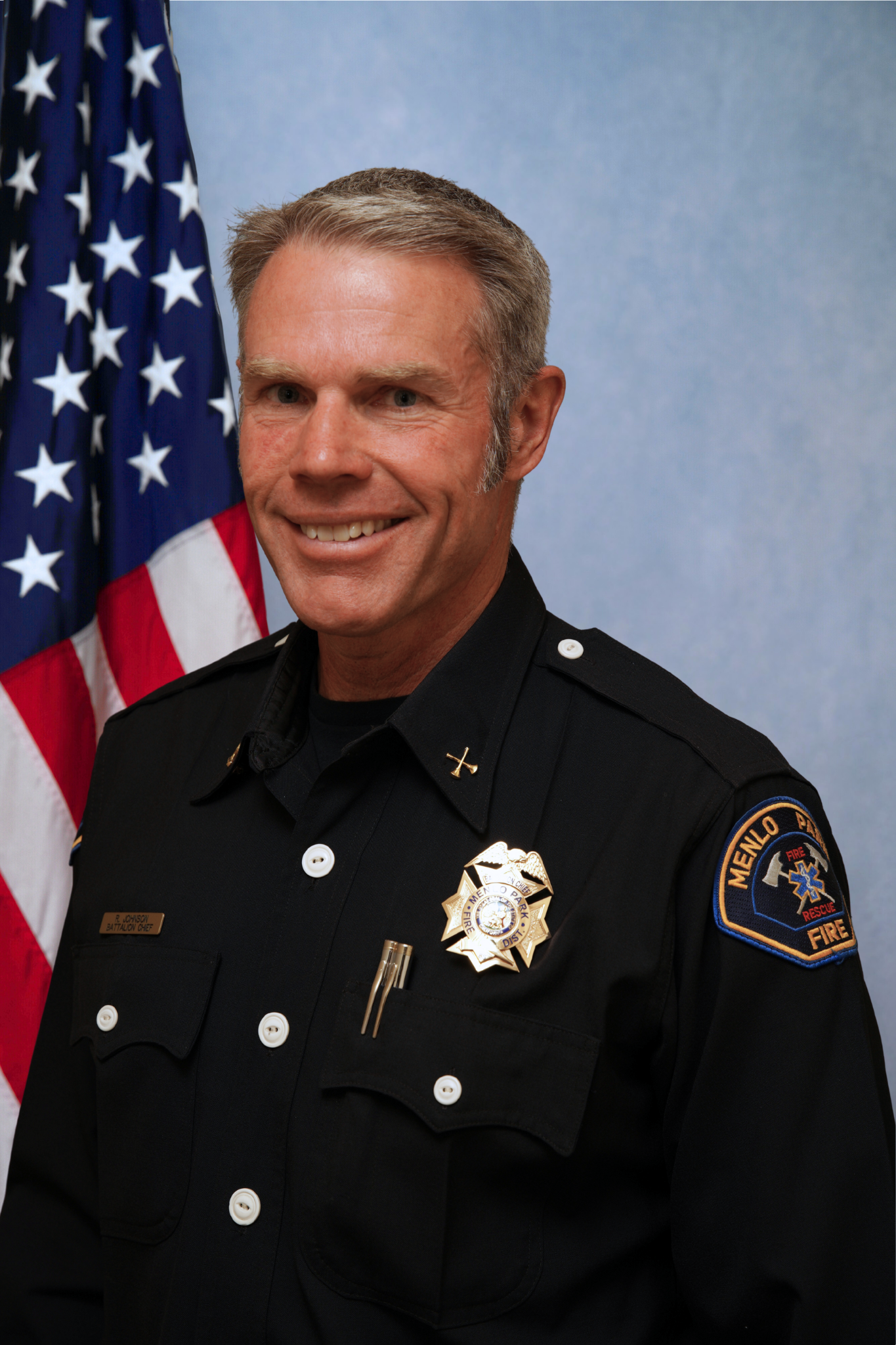 Portrait of Robert Johnson, smiling.